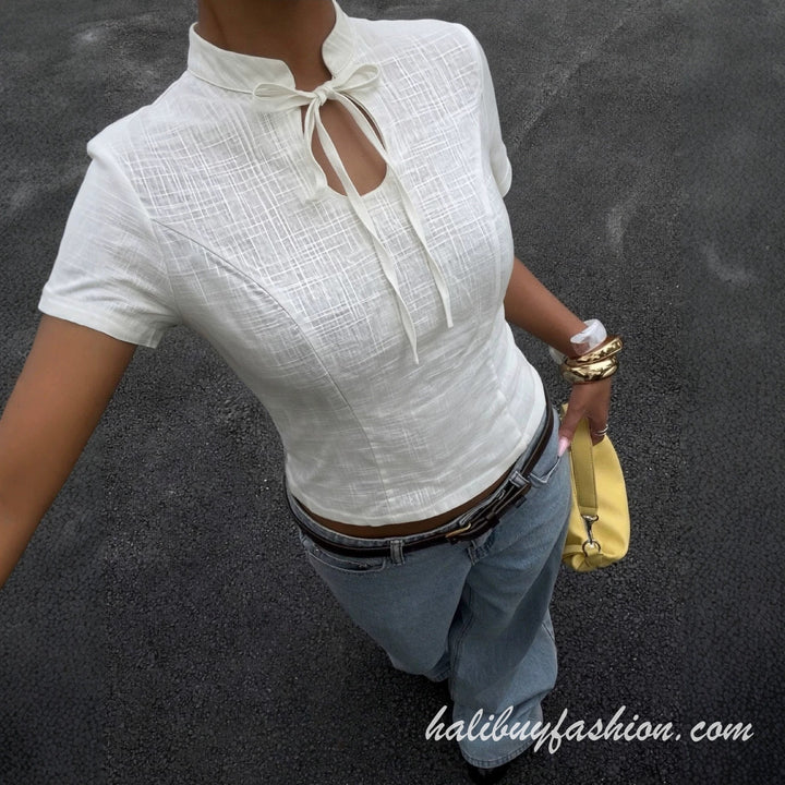 Short sleeve hollow out self tie solid textured top