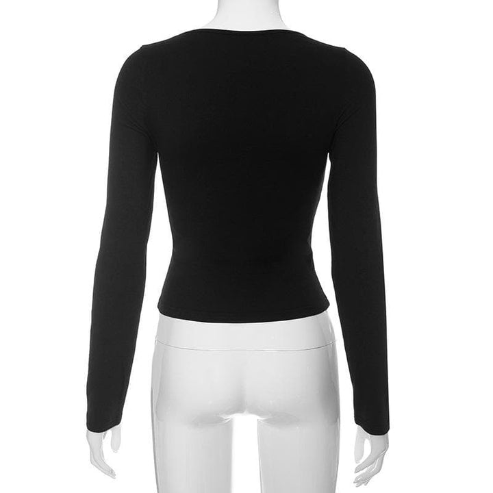 Round neck bowknot hollow out long sleeve solid cut out top